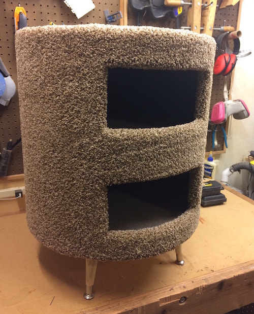 a round carpeted two-story cat condo.